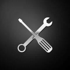 Silver Spanner and screwdriver tools icon isolated on black background. Service tool symbol. Long shadow style. Vector.