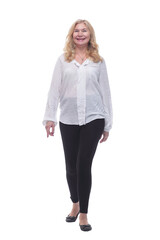 Fototapeta premium happy mature woman in a new blouse striding forward.