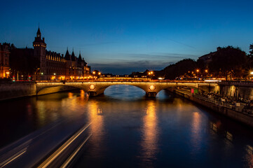 Paris, France - July 20, 2019: Night view of River Seine and Bridge of Change (Pont au Change) in Paris, France