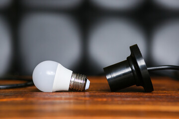unscrewed lamp near to a cartridge for a lamp. Lack, power outage. Electricity is not supplied to...