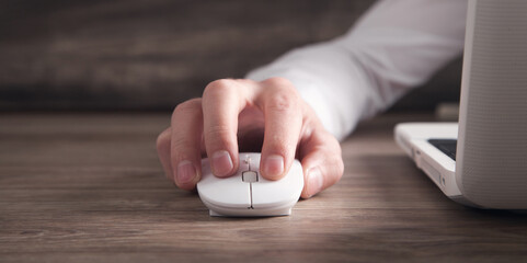  Male hand clicking computer mouse. Internet. Business. Technology