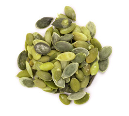 Pumpkin seeds isolated on white background. Green pepita seeds. Top view.