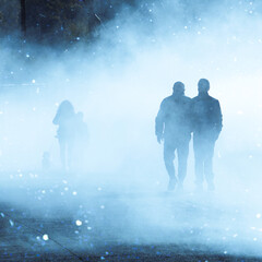 people walking on the street with fog in Bilbao city, spain