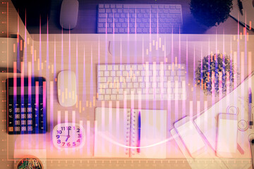 Multi exposure of forex graph drawing over desktop background with computer. Concept of financial...