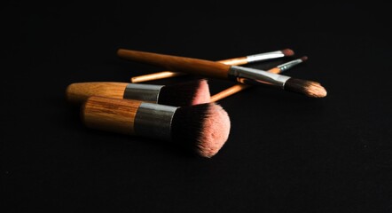 makeup brushes set on dark background
