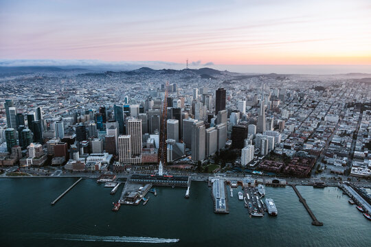 Aerial of downtown and piers at sunset, San Francisco, USA