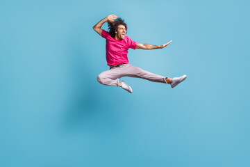 Full length body size view of attractive cheerful crazy motivated guy jumping dancing ballet isolated over bright blue color background