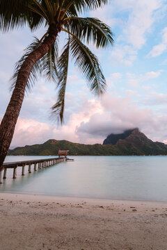 Jetty at dawn, in the lagoon of Bora Bora, French Polynesia
