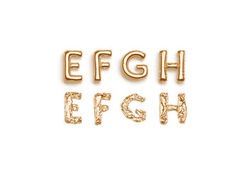 Inflated, deflated gold E F G H letters, balloon font © Alexandr Bognat