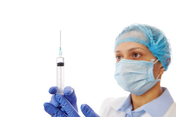 Health worker preparing a vaccine. Doctor holding a syringe with hypodermic needle. Medical...