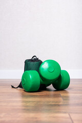 Two fitness dumbbells on the floor