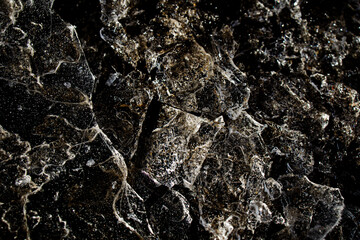 nteresting abstract background with ice close-up on a frozen puddle