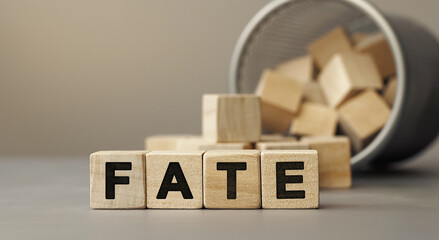 FATE - word concept from wooden blocks on desk