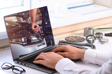 . Car repair courses. On the table are a computer and tools for car repair. Online learning