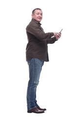 Naklejka premium mature man with a smartphone pointing at a white screen .