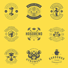 Naklejka premium Fitness center and sport gym logos and badges design set vector illustration