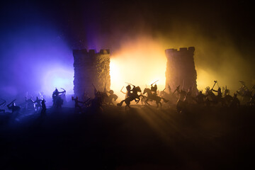 Fototapeta na wymiar Medieval battle scene. Silhouettes of figures as separate objects, fight between warriors at night. Creative artwork decoration. Foggy background.