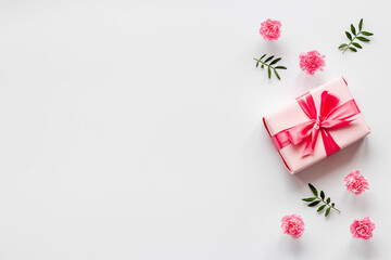 Valentines Day background with pink gift box and flowers