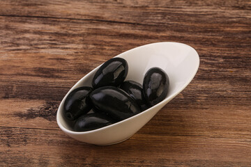 Pickled black olives in the bowl