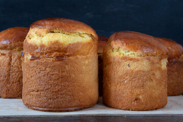 Freshly baked Easter cake cools down. Lots of different sizes. Traditional Kulich, Paska Easter Bread