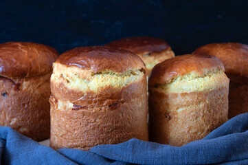 Freshly baked Easter cake cools down. Lots of different sizes. Traditional Kulich, Paska Easter Bread