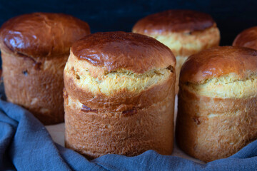 Freshly baked Easter cake cools down. Lots of different sizes. Traditional Kulich, Paska Easter Bread