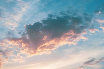 Beautiful lush cloud, colorful bright sunrise, warm shades sky with warm rays sun.