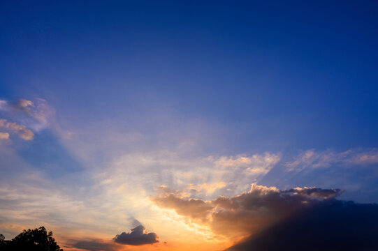 Sunbeams Breaking Through The Clouds With Blue And Orange Sky. Hope, Prayer Concept For Background.