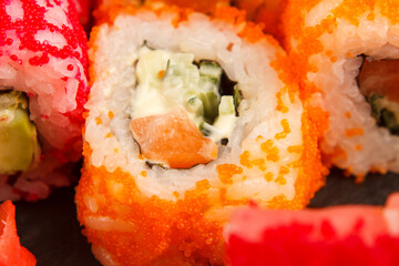 Set of salmon sushi and rolls with salmon and eel, top view