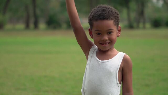 portrait of a child, happy african american kids boy playing outdoors in a park, Kid playing concepts