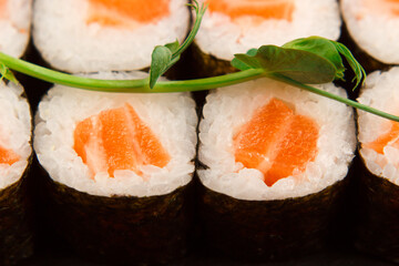 Set of salmon sushi and rolls with salmon and eel, top view