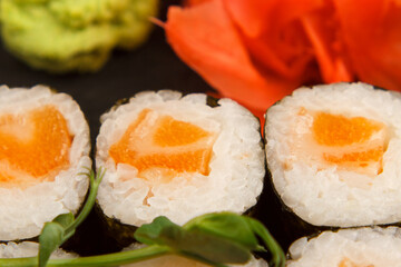 Set of salmon sushi and rolls with salmon and eel, top view