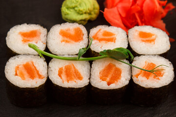 Set of salmon sushi and rolls with salmon and eel, top view