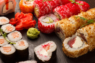 Set of salmon sushi and rolls with salmon and eel, top view
