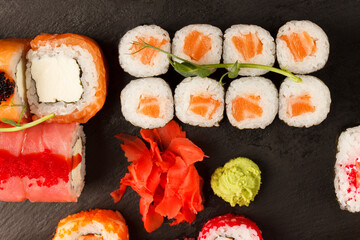Japanese food: Set of salmon sushi and rolls with salmon and eel