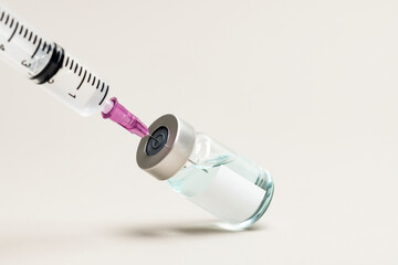 Blank white label on injection bottle glass vial with syringe