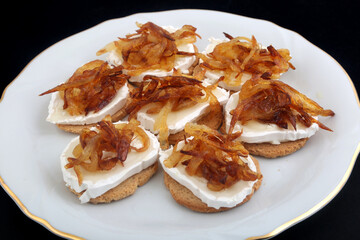 Mozzarella and fried onion toast canape as appetizer