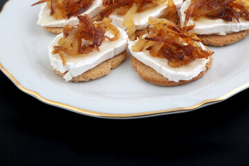 Mozzarella and fried onion toast canape as appetizer