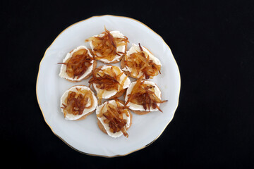 Mozzarella and fried onion toast canape as appetizer
