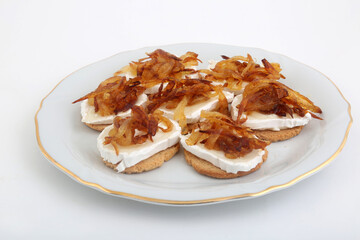 Mozzarella and fried onion toast canape as appetizer