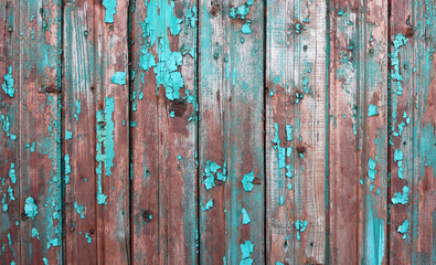 old brown wood background with peeling turquoise paint