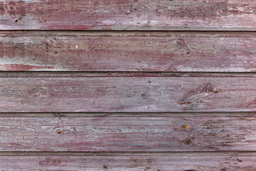 Obraz premium Painted wood background. High resolution image of weathered wood planks with red purple paint