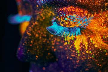 close up uv portrait glowing in a dark © fyb