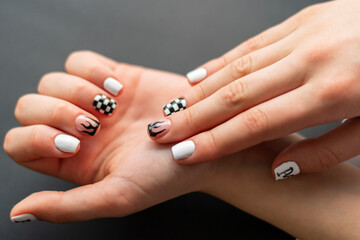 fingernails painted with different fashion designs