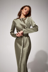 Beauty brunette woman luxury lifestyle bright makeup wear natural organic silk midi dress high...