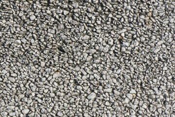 Pebble stone background. Small rocks texture. Gray mineral background. Cobblestone pattern. Pavement decorative construction.