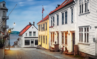 Fototapeta na wymiar Bergen, Norway old narrow street with wooden houses at twilight.