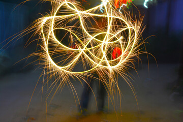 sparkler on fire and light panting with fireworks