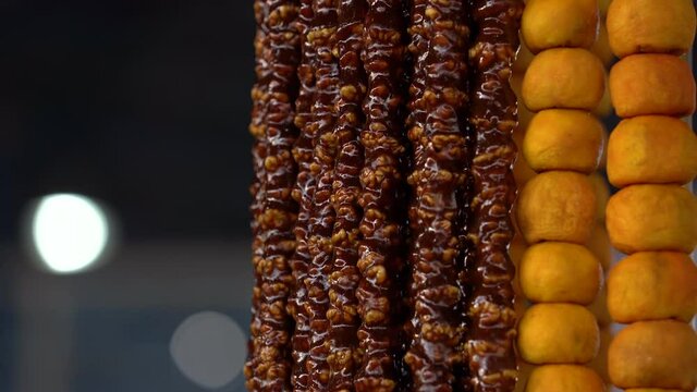 Sweet churchkhela in market for sale. Close view churchkhela hangs in food shop.