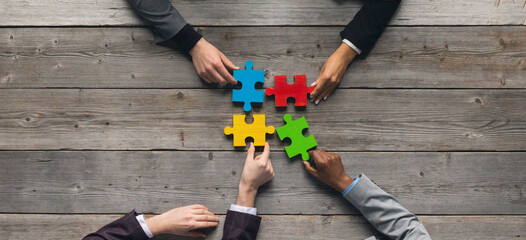 Business teamwork with puzzle